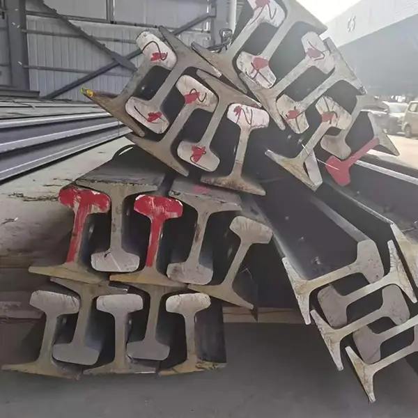 three bundles of steel rails